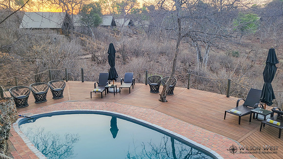 Pool at our lodge, cabins behind